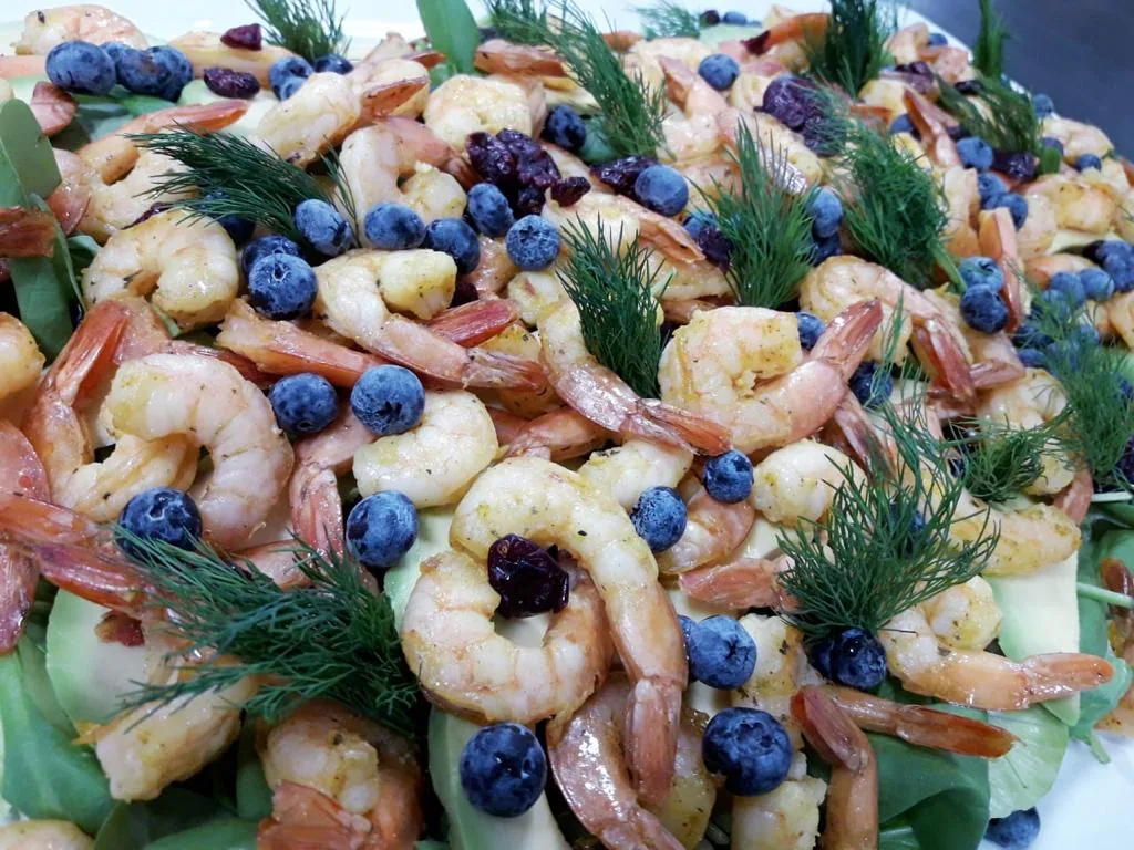 Shrimp with blueberries and fresh herbs