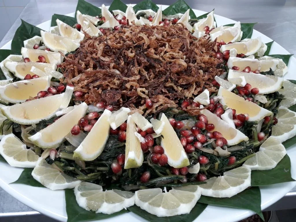 Middle Eastern greens with pomegranate and lemon